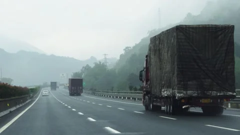 2026 Jun 06, Guangzhou. Rear View of Trucks and Cars Driving Away Stock-Footage 335579093