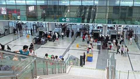2026 Jun 30, Shanghai. High-angle daytime busy transit station security Stock Footage 338232031