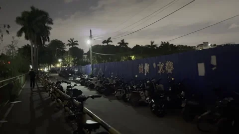 2026 Mar 23, Guangzhou. Two Silhouettes Walk Away on Night Street Stock Footage 335772404
