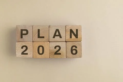 2026 plan words text on wooden cube isolated on paper background. New strat.. Stock Photos