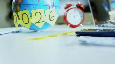 2026 Planning with Globe and Clock, Globe with sticky notes spelling 2026, .. Stock Footage 321223939