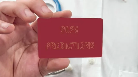 2026 PREDICTIONS words appear on a red card in the mans hand. Supporting Stock Footage 318427098