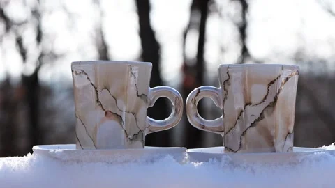 2026 Steaming Hot Coffee Cups on Snow Near Forest on Sunny Winter Day Stock Footage 327041159
