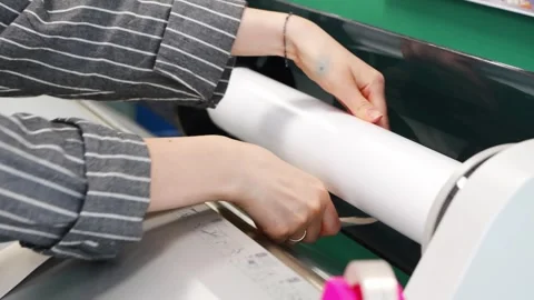 2026.06.18, Russia. Preparing wide format plotter for photo printing Stock Footage 337460830
