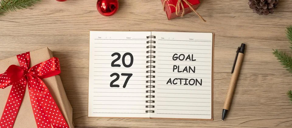 2027 Goal Plan Action with notebook, Christmas gift and pen on wood table. .. Stock Photos
