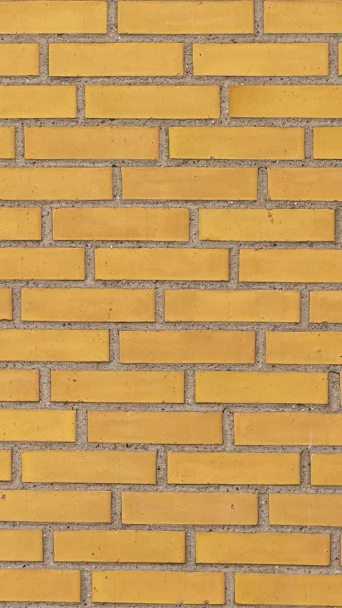 202_Yellow brick wall surface pattern.mp4 Stock Footage 347072770