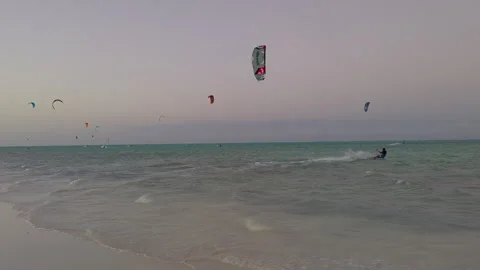 20s 4k Kite Surfer Sails from Beach to Deep Water Jumps in the Distance Doe.. Stock Footage 246766630