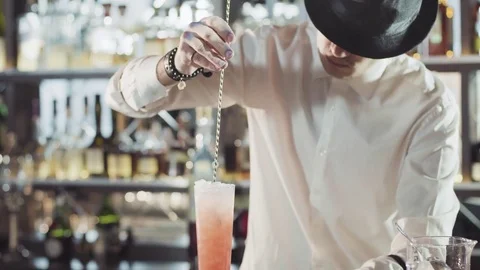 20s bartender is preparing cocktail in a night bar Stock Footage 75232495