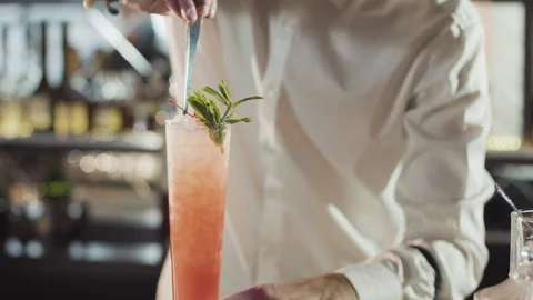 20s bartender is preparing cocktail in a night bar Stock Footage 75232719