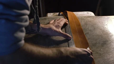 20s young Man working in his workshop with leather using crafting DIY tools Stock Footage 71388784