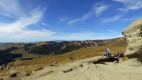 21 June 2018 Bucegi Romania Toursit relaxing on Bucegi plateau Stock Footage 102380652