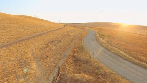 2.139 Fairfield Windmills Flying Forward Low Along Road With Windmills in the Stock Footage 90257595
