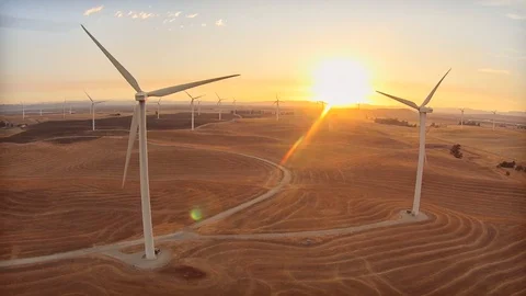 2.142 Fairfield Windmills Tracking Left Along Windmills With Sun Setting in the Stock Footage 90257609