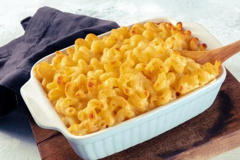Macaroni  and  cheese  pasta  in  a  casserole.  Cheesy  American  comfort  food,  baked  in  the  oven xkwx cheese,  macaroni,  mac,  pasta,  cheesy,  casserole,  sauce,  dish,  cheddar,  american,  gratin,  noodle,  cream,  baked,  crunchy,  food,  table,  rustic,  wooden,  wood,  dinner,  meal,  cuisine,  oven,  classic,  healthy,  kid,  homemade,  gourmet,  lunch,  parmesan,  bake,  mozzarella,  yellow,  pie,  recipe,  dairy,  traditional,  comfort