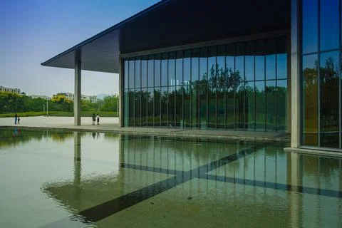 Hangzhou, China, September 15th, 2019 : The Facade of Liangzhu Village Cultural Art Centre by Tadao Ando xkwx building business center china architecture area art background block sky blue house modern museum office perspective reflection landscape nature travel light outdoor road facade geometric glass hangzhou landmark city construction design district downtown evening urban view window beautiful structure tadao tadao ando tourism tower snow white dusk abstract ando