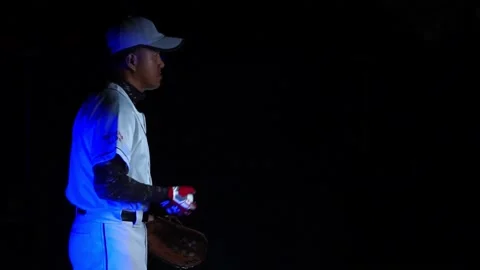 21A baseball player pitcher with his baseball and baseball gloves Stock Footage 227733251