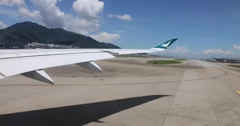 22 6 2022 wing of cathay pacific airplane taxiing before taking off in Hong K Stock Footage 208909706