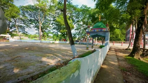 22 Horizontal Pan Slide Reveal of Prayer Dome and Roadside Trees - June 13 Stock Footage 313650876
