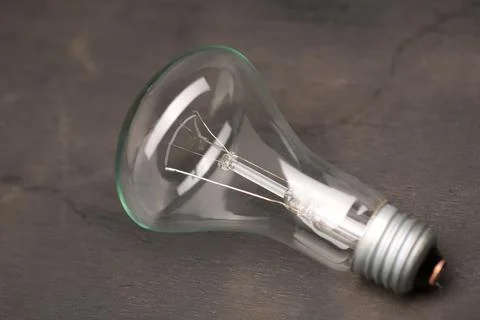 220 volt bulb on a black background Stock Photos