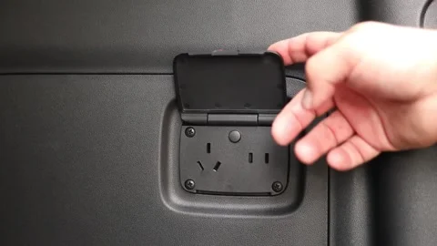 220-volt socket in the car trunk Stock Footage 345594694