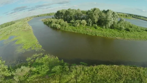 222. Quadrocopter, flies over the river enveloping a small island. Stock-Footage 93748904