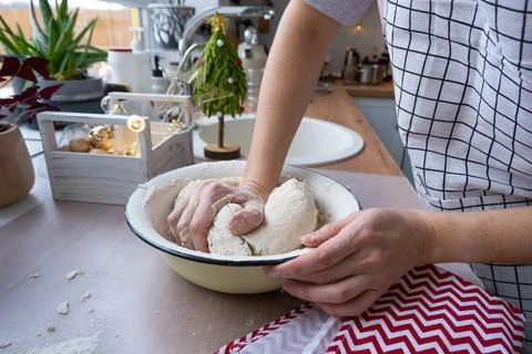 Hands  knead  thick  dough  on  the  kitchen  table,  decorated  with  festive  decorations  for  Christmas  and  New  year.  Baking  at  home,  aroma  and  comfort.  Close-up xkwx knead,  thick,  dough,  kitchen,  table,  Christmas,  New  year,  Baking,  home,  aroma,  comfort,  Close  up,  Hands,  flour,  cookies,  housewife,  pizza,  wheat,  bread,  mood,  cozy,  interior,  decor,  preparing,  sculpt,  woman,  cook,  lifestyle,  dessert,  cutting,  form,  prepare,  knead,  making,  shape,  raw,  baker,  recipe,  kneading,  cooking,  pastry,  sweet,  winter,  holiday,  cookie,  bake,  preparation,  bakery,  homemade,  food