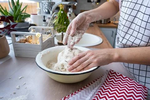Hands  knead  thick  dough  on  the  kitchen  table,  decorated  with  festive  decorations  for  Christmas  and  New  year.  Baking  at  home,  aroma  and  comfort.  Close-up xkwx knead,  thick,  dough,  kitchen,  table,  Christmas,  New  year,  Baking,  home,  aroma,  comfort,  Close  up,  Hands,  flour,  cookies,  housewife,  pizza,  wheat,  bread,  mood,  cozy,  interior,  decor,  preparing,  sculpt,  woman,  cook,  lifestyle,  dessert,  cutting,  form,  prepare,  knead,  making,  shape,  raw,  baker,  recipe,  kneading,  cooking,  pastry,  sweet,  winter,  holiday,  cookie,  bake,  preparation,  bakery,  homemade,  food