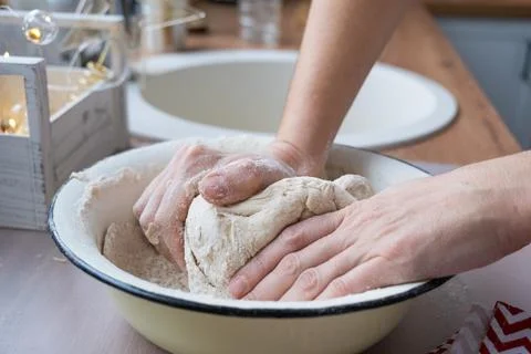 Hands  knead  thick  dough  on  the  kitchen  table,  decorated  with  festive  decorations  for  Christmas  and  New  year.  Baking  at  home,  aroma  and  comfort.  Close-up xkwx knead,  thick,  dough,  kitchen,  table,  Christmas,  New  year,  Baking,  home,  aroma,  comfort,  Close  up,  Hands,  flour,  cookies,  housewife,  pizza,  wheat,  bread,  mood,  cozy,  interior,  decor,  preparing,  sculpt,  woman,  cook,  lifestyle,  dessert,  cutting,  form,  prepare,  knead,  making,  shape,  raw,  baker,  recipe,  kneading,  cooking,  pastry,  sweet,  winter,  holiday,  cookie,  bake,  preparation,  bakery,  homemade,  food