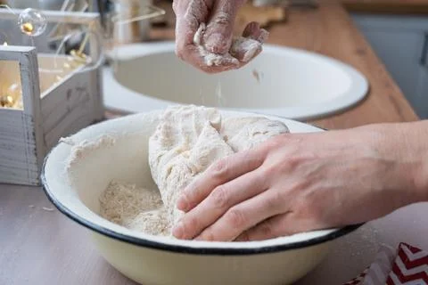 Hands  knead  thick  dough  on  the  kitchen  table,  decorated  with  festive  decorations  for  Christmas  and  New  year.  Baking  at  home,  aroma  and  comfort.  Close-up xkwx knead,  thick,  dough,  kitchen,  table,  Christmas,  New  year,  Baking,  home,  aroma,  comfort,  Close  up,  Hands,  flour,  cookies,  housewife,  pizza,  wheat,  bread,  mood,  cozy,  interior,  decor,  preparing,  sculpt,  woman,  cook,  lifestyle,  dessert,  cutting,  form,  prepare,  knead,  making,  shape,  raw,  baker,  recipe,  kneading,  cooking,  pastry,  sweet,  winter,  holiday,  cookie,  bake,  preparation,  bakery,  homemade,  food