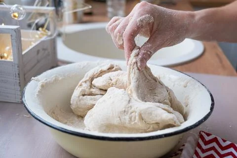Hands  knead  thick  dough  on  the  kitchen  table,  decorated  with  festive  decorations  for  Christmas  and  New  year.  Baking  at  home,  aroma  and  comfort.  Close-up xkwx knead,  thick,  dough,  kitchen,  table,  Christmas,  New  year,  Baking,  home,  aroma,  comfort,  Close  up,  Hands,  flour,  cookies,  housewife,  pizza,  wheat,  bread,  mood,  cozy,  interior,  decor,  preparing,  sculpt,  woman,  cook,  lifestyle,  dessert,  cutting,  form,  prepare,  knead,  making,  shape,  raw,  baker,  recipe,  kneading,  cooking,  pastry,  sweet,  winter,  holiday,  cookie,  bake,  preparation,  bakery,  homemade,  food