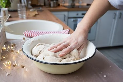 Hands  knead  thick  dough  on  the  kitchen  table,  decorated  with  festive  decorations  for  Christmas  and  New  year.  Baking  at  home,  aroma  and  comfort.  Close-up xkwx knead,  thick,  dough,  kitchen,  table,  Christmas,  New  year,  Baking,  home,  aroma,  comfort,  Close  up,  Hands,  flour,  cookies,  housewife,  pizza,  wheat,  bread,  mood,  cozy,  interior,  decor,  preparing,  sculpt,  woman,  cook,  lifestyle,  dessert,  cutting,  form,  prepare,  knead,  making,  shape,  raw,  baker,  recipe,  kneading,  cooking,  pastry,  sweet,  winter,  holiday,  cookie,  bake,  preparation,  bakery,  homemade,  food