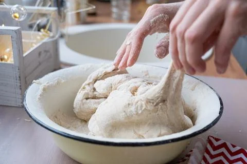 Hands  knead  thick  dough  on  the  kitchen  table,  decorated  with  festive  decorations  for  Christmas  and  New  year.  Baking  at  home,  aroma  and  comfort.  Close-up xkwx knead,  thick,  dough,  kitchen,  table,  Christmas,  New  year,  Baking,  home,  aroma,  comfort,  Close  up,  Hands,  flour,  cookies,  housewife,  pizza,  wheat,  bread,  mood,  cozy,  interior,  decor,  preparing,  sculpt,  woman,  cook,  lifestyle,  dessert,  cutting,  form,  prepare,  knead,  making,  shape,  raw,  baker,  recipe,  kneading,  cooking,  pastry,  sweet,  winter,  holiday,  cookie,  bake,  preparation,  bakery,  homemade,  food