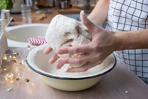 Hands  knead  thick  dough  on  the  kitchen  table,  decorated  with  festive  decorations  for  Christmas  and  New  year.  Baking  at  home,  aroma  and  comfort.  Close-up xkwx knead,  thick,  dough,  kitchen,  table,  Christmas,  New  year,  Baking,  home,  aroma,  comfort,  Close  up,  Hands,  flour,  cookies,  housewife,  pizza,  wheat,  bread,  mood,  cozy,  interior,  decor,  preparing,  sculpt,  woman,  cook,  lifestyle,  dessert,  cutting,  form,  prepare,  knead,  making,  shape,  raw,  baker,  recipe,  kneading,  cooking,  pastry,  sweet,  winter,  holiday,  cookie,  bake,  preparation,  bakery,  homemade,  food