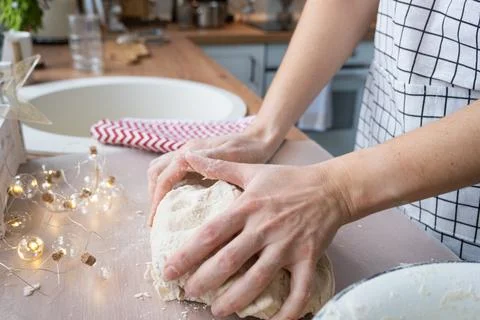 Hands  knead  thick  dough  on  the  kitchen  table,  decorated  with  festive  decorations  for  Christmas  and  New  year.  Baking  at  home,  aroma  and  comfort.  Close-up xkwx knead,  thick,  dough,  kitchen,  table,  Christmas,  New  year,  Baking,  home,  aroma,  comfort,  Close  up,  Hands,  flour,  cookies,  housewife,  pizza,  wheat,  bread,  mood,  cozy,  interior,  decor,  preparing,  sculpt,  woman,  cook,  lifestyle,  dessert,  cutting,  form,  prepare,  knead,  making,  shape,  raw,  baker,  recipe,  kneading,  cooking,  pastry,  sweet,  winter,  holiday,  cookie,  bake,  preparation,  bakery,  homemade,  food