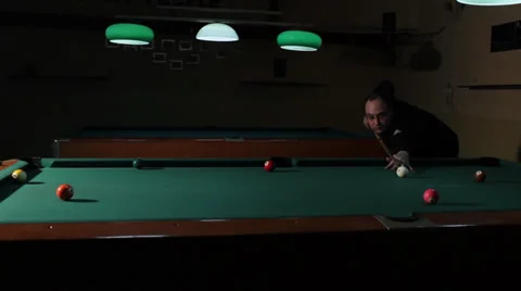 22/35 Man playing billiard. Player is taking a shot and put ball in the hole. Vídeos de archivo 36431284