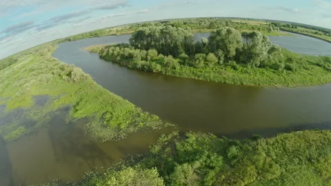 224.  Quadrocopter, flies over the river enveloping a small island. Stock Footage 93751859