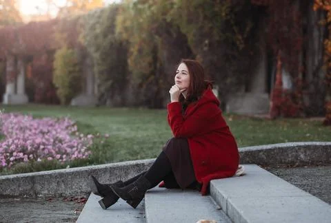 elegant young woman in a burgundy casual coat in autumn. Cute model walks in the park in golden autumn through colorful trees and fallen leaves. Autumn walk, colorful nature xkwx attractive, autumn, beautiful, beauty, casual, charming, cheerful, city, coat, colorful, day, emotion, europe, face, fall, fashion, female, fun, girl, hair, lady, leaf, leisure, lifestyle, model, nature, outdoor, outdoors, outside, park, person, portrait, positive, red, season, style, urban, walk, weather, woman, young