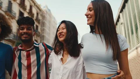 Video: Happy multiethnic young people walk embracing on summer day ...