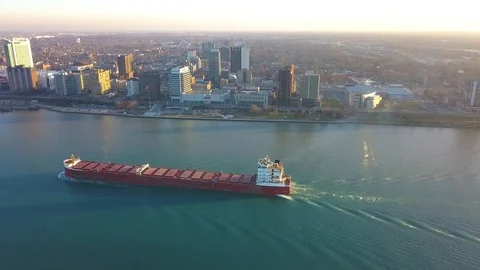 228 Aerial river cargo ship city in the background 動画素材 104554571