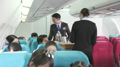 2282 Cabin crew serve snack in the flight Stock Footage