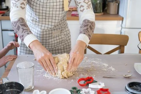 Hands  knead  thick  dough  on  the  kitchen  table,  decorated  with  festive  decorations  for  Christmas  and  New  year.  Baking  at  home,  aroma  and  comfort.  Close-up xkwx knead,  thick,  dough,  kitchen,  table,  christmas,  flour,  new  year,  baking,  molds,  cookies,  snowman,  home,  aroma,  comfort,  hands,  housewife,  bakery,  wheat,  bread,  mood,  cozy,  interior,  decor,  preparing,  sculpt,  woman,  cook,  homemade,  dessert,  cutting,  form,  prepare,  making,  shape,  raw,  baker,  recipe,  kneading,  cooking,  pastry,  sweet,  winter,  holiday,  cookie,  bake,  eating,  hand,  cuisine