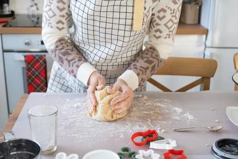 Hands  knead  thick  dough  on  the  kitchen  table,  decorated  with  festive  decorations  for  Christmas  and  New  year.  Baking  at  home,  aroma  and  comfort.  Close-up xkwx knead,  thick,  dough,  kitchen,  table,  christmas,  flour,  new  year,  baking,  molds,  cookies,  snowman,  home,  aroma,  comfort,  hands,  housewife,  bakery,  wheat,  bread,  mood,  cozy,  interior,  decor,  preparing,  sculpt,  woman,  cook,  homemade,  dessert,  cutting,  form,  prepare,  making,  shape,  raw,  baker,  recipe,  kneading,  cooking,  pastry,  sweet,  winter,  holiday,  cookie,  bake,  eating,  hand,  cuisine
