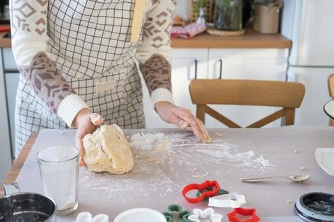 Hands  knead  thick  dough  on  the  kitchen  table,  decorated  with  festive  decorations  for  Christmas  and  New  year.  Baking  at  home,  aroma  and  comfort.  Close-up xkwx knead,  thick,  dough,  kitchen,  table,  christmas,  flour,  new  year,  baking,  molds,  cookies,  snowman,  home,  aroma,  comfort,  hands,  housewife,  bakery,  wheat,  bread,  mood,  cozy,  interior,  decor,  preparing,  sculpt,  woman,  cook,  homemade,  dessert,  cutting,  form,  prepare,  making,  shape,  raw,  baker,  recipe,  kneading,  cooking,  pastry,  sweet,  winter,  holiday,  cookie,  bake,  eating,  hand,  cuisine