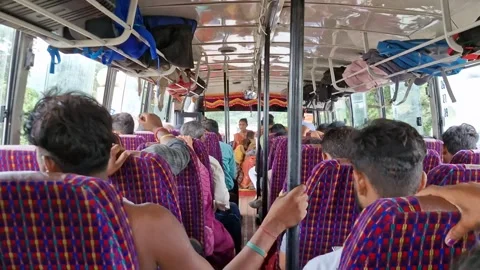 23-7-24; View of passengers sitting on seats inside a bus and traveling in India Video stock 281485625