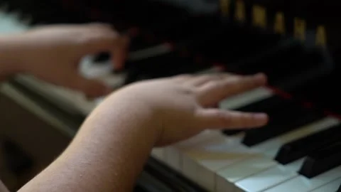 2/3 Closeup of Boy hands playing old vintage piano keyboard Stock Footage 203841217