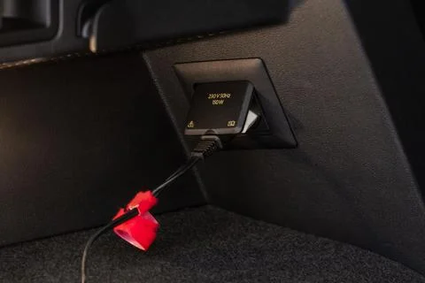230v power outlet socket in the car. Opened sockets. Stock Photos