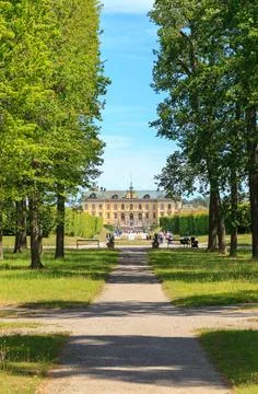 Stockholm, Sweden - June 23, 2019: Palace Garden and Drottningholm Palace xkwx palace, sweden, tourism, garden, landmark, park, building, stockholm, drottningholm, architecture, travel, scandinavia, historic, royal, attraction, sky, drottningholm palace, swedish, old, heritage, summer, castle, residence, style, culture, facade, baroque, outdoor, statue, tourist, europe, famous, blue, green, sculpture, family, nordic, unesco, king, history, scenery, house, drottningholms slott, lawn, wealth, historical, tree, seat, luxury
