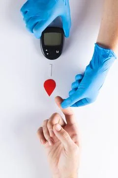 Hands of gloved doctor with glucometer taking blood sugar reading from caucasian woman. Blood sugar, diabetes and health awareness. xkwx Two People, Mid Adult, Man, Male, White, Mature Adult, Woman, Female, People, Hand, Gloved, Doctor, Glucometer, Taking, Blood, Sugar, Reading, Caucasian Woman, Diabetes, Health, Awareness, Medical, Medicine, Hospital, Clinic, Healthcare, Care, Patient, Diabetic, Treatment, Disease, Glucose, Illness, Healthy, Insulin, Nurse, Hypoglycaemia, Professional, Laboratory, Test, Person, Caucasian