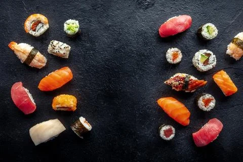 Sushi  frame,  a  flat  lay,  top  shot.  Rolls,  maki,  nigiri  on  a  black  slate  background,  Japanese  food.  Salmon,  eel,  shrimp,  tuna  etc  with  rice,  with  a  place  for  text xkwx sushi,  roll,  frame,  japanese,  food,  maki,  nigiri,  japan,  black,  background,  salmon,  sashimi,  tuna,  restaurant,  asian,  set,  avocado,  plate,  dinner,  seafood,  gourmet,  eat,  raw,  eel,  rice,  shrimp,  fish,  menu,  california,  philadelphia,  traditional,  overhead,  above,  view,  top,  shot,  flat,  lay,  flatlay,  flat  lay,  banner,  dish,  cheese,  tobiko,  cucumber,  meal,  lunch,  slate,  uramaki,  whitefish