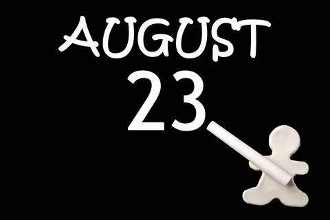 23rd day of August. A small white plasticine man writing the date 23 August o Stock Photos